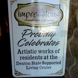 Impressions Handmade Ceramics - Sign on door.