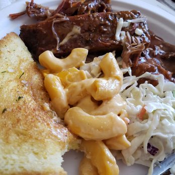 Dan's BBQ - A sample of my sample platter:  brisket, pulled pork, rib, Cole slaw, chili beans, Texas toast (yeah, I bit into it). - American Near Me - Modesto, California