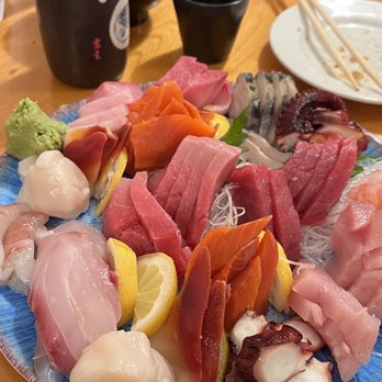 Toyoda Sushi - Sashimi Platter with hot sake - Sushi Bars Near Me - Seattle, Washington Toyoda Sushi - Sashimi Platter with hot sake - Sushi Bars Near Me - Seattle, Washington
