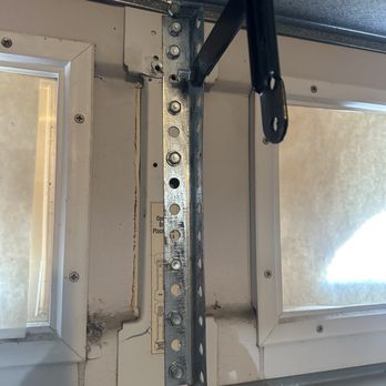 Premier Garage Doors & Gates - The bracket that he used is much more secure than the previous one. - Garage Door Services Near Me - Anaheim, California Premier Garage Doors & Gates - The bracket that he used is much more secure than the previous one. - Garage Door Services Near Me - Anaheim, California