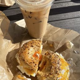 Iced vanilla latte (light syrup) and egg and cheese bagel Iced vanilla latte (light syrup) and egg and cheese bagel