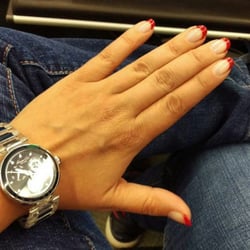 The Nail Room - Happy client with holiday nails.