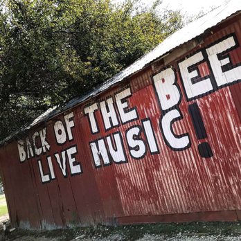 Busy Bee Cafe - a red building with a sign that says back of the bee live music - Burgers Near Me - Maypearl, Texas
