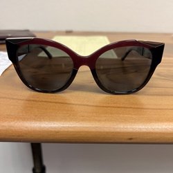 Nina Optical & Eye Glass - Fixed Prada sunglasses.  Repaired cracked plastic frame by the right nose/bridge.