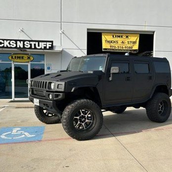 LINE-X Trucks-N-Stuff - Lifted black truck with LINE-X bedliner and accessories in Plano Texas - Auto Parts & Supplies Near Me - Plano, Texas