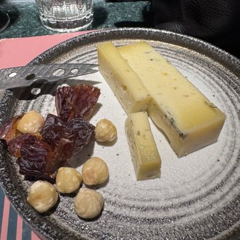 Kaasbar Amsterdam - Delicious cheese either herbs and accompanied by hazelnut and dates. - Bars Near Me - Amsterdam, New Hampshire