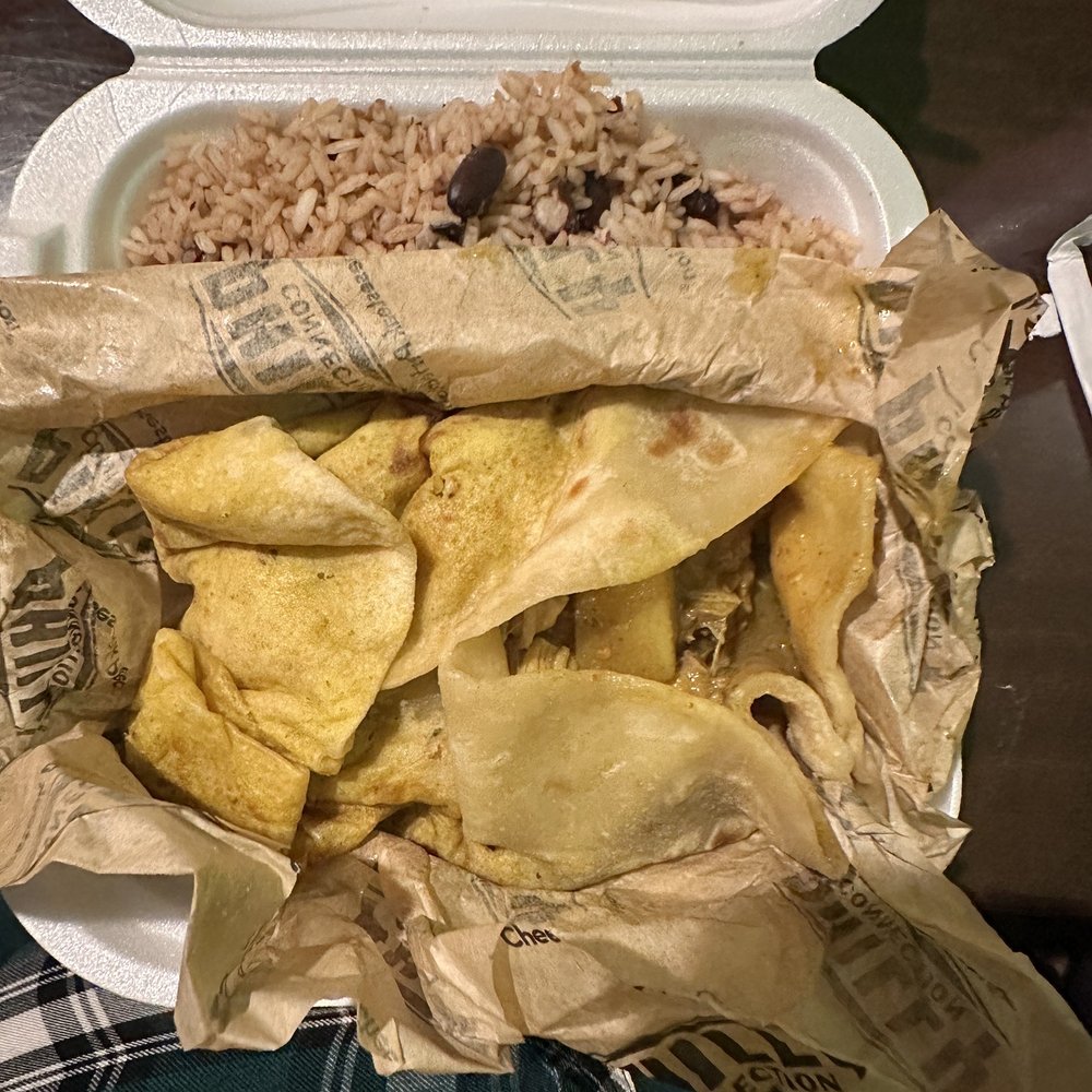 Curry chicken roti with rice and peas