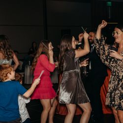 Sunkisst Entertainment - Crowd having fun on the dance floor during wedding reception. Photo credits: www.michellewallacephotographytx.com