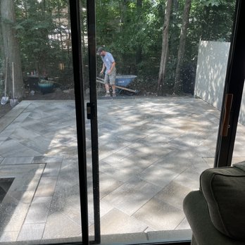 Higher Ground Landscaping - a man mowing a patio - Landscaping Near Me Higher Ground Landscaping - a man mowing a patio - Landscaping Near Me