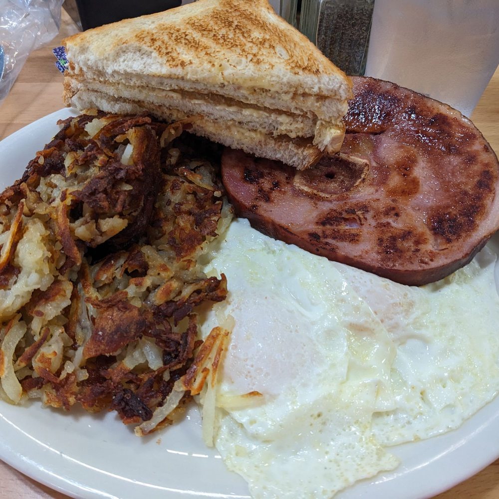 Ham steak, potatoes, 2 eggs and toast.