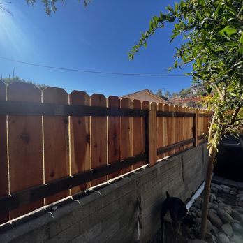 Modesto Ayala Fence - New redwood fence with metal posts installed through existing retaining wall - Fences & Gates Near Me - San Diego, California Modesto Ayala Fence - New redwood fence with metal posts installed through existing retaining wall - Fences & Gates Near Me - San Diego, California