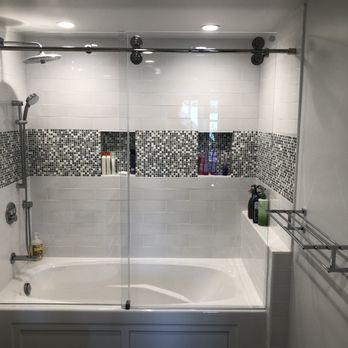 Diviney Construction - a bathtub and shower in a bathroom - General Contractors Near Me - San Francisco, California