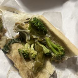 Sack O' Subs - Whole broccoli on a sandwich .