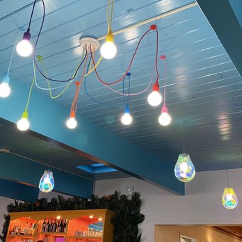 Beachy’s - Fun, colorful light fixture to get the mood started. - Burgers Near Me - Caseville, Michigan