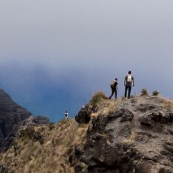 Awa'awapuhi Trail - Some brave hikers venturing past the initial rock lookout platform, all during midday fogginess.