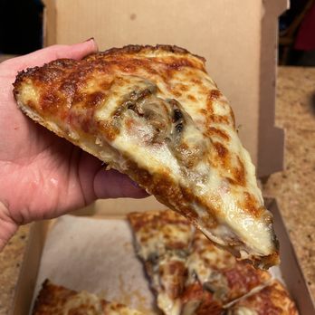 Luigi's Restaurant - Slice of pepperoni and mushroom pizza - Pizza Near Me - Akron, Ohio Luigi's Restaurant - Slice of pepperoni and mushroom pizza - Pizza Near Me - Akron, Ohio