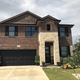 Exterior outside entrance of Texas Made Windows and More - After we replaced with Black Aluminum windows. Exterior outside entrance of Texas Made Windows and More - After we replaced with Black Aluminum windows.