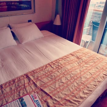 Carnival Glory - The bed and our balcony on the right - Travel Services Near Me - Miami, Florida Carnival Glory - The bed and our balcony on the right - Travel Services Near Me - Miami, Florida