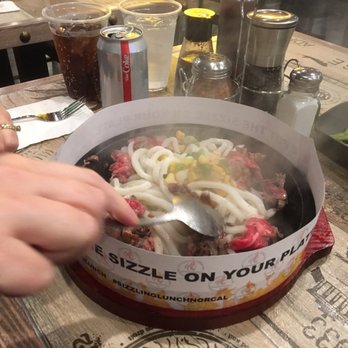 Sizzling Lunch - Stirring it up to cook the meat evenly. - Steakhouses Near Me - Cupertino, California Sizzling Lunch - Stirring it up to cook the meat evenly. - Steakhouses Near Me - Cupertino, California