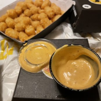 Buffalo Wild Wings - a bowl of mustard and a container of tater tots - Sports Bars Near Me - Kennewick, Washington Buffalo Wild Wings - a bowl of mustard and a container of tater tots - Sports Bars Near Me - Kennewick, Washington