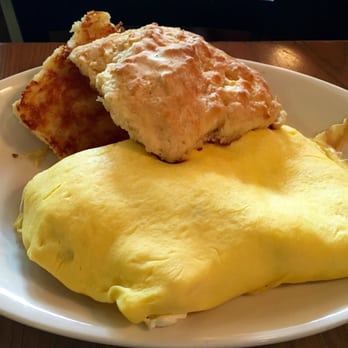 Colossal Cafe - Maybe this omelette isn't gourmet pretty but it's delish! Bacon, cream cheese, spring onion with a biscuit. - American Near Me - Saint Paul, Minnesota Colossal Cafe - Maybe this omelette isn't gourmet pretty but it's delish! Bacon, cream cheese, spring onion with a biscuit. - American Near Me - Saint Paul, Minnesota