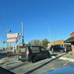 George's Liquors - Store sign & delivery service vehicle