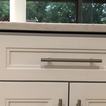Carr Cabinets - A not leveled cabinet that has about 6 shims on top to make it level. Huge gap. The door won't close properly due to it or being balanced. - Cabinetry Near Me Carr Cabinets - A not leveled cabinet that has about 6 shims on top to make it level. Huge gap. The door won't close properly due to it or being balanced. - Cabinetry Near Me