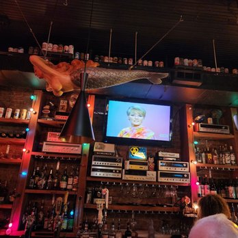 Ate Track - a woman sitting at a bar - New American Near Me - Cartersville, Georgia
