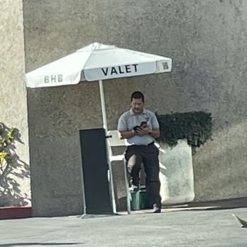 BHB Valet - BHB valet employee outside of the US Bank and Starbucks at the corner of Vermont and Prospect in Los Feliz. - Valet Services Near Me - West Hollywood, California BHB Valet - BHB valet employee outside of the US Bank and Starbucks at the corner of Vermont and Prospect in Los Feliz. - Valet Services Near Me - West Hollywood, California