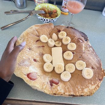 Loulou's Griddle In the Middle - Pancake with potatoes and an "almost finished" guava mimosa. - Breakfast & Brunch Near Me - Monterey, California Loulou's Griddle In the Middle - Pancake with potatoes and an "almost finished" guava mimosa. - Breakfast & Brunch Near Me - Monterey, California