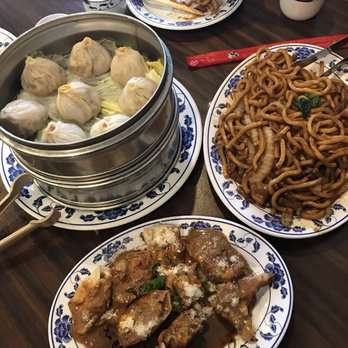Liu's Shanghai - Crab and pork xiao long bao stacked w/ Shanghai noodles and some fried wontons in a peanut sauce and hot sauce - Shanghainese Near Me - Brooklyn, New York
