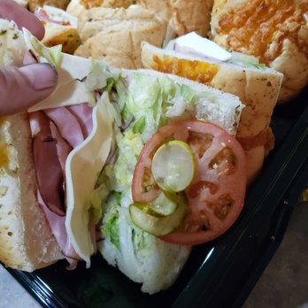 Subway - a person grabbing a sandwich from a tray - Sandwiches Near Me - Allegan, Michigan Subway - a person grabbing a sandwich from a tray - Sandwiches Near Me - Allegan, Michigan