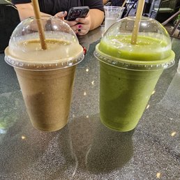 Left is house smoothie with kale added (pineapple, strawberry, banana), right is squeeze smoothie (orange juice, pineapple, mango, kale). Left is house smoothie with kale added (pineapple, strawberry, banana), right is squeeze smoothie (orange juice, pineapple, mango, kale).