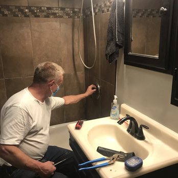 J & D Plumbing & Heating - Steve masked up during COVID, replacing the hot water valve in our shower. - Plumbing Near Me - Long Beach, California J & D Plumbing & Heating - Steve masked up during COVID, replacing the hot water valve in our shower. - Plumbing Near Me - Long Beach, California