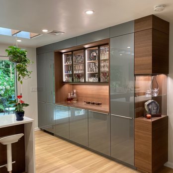 Elite Kitchens & Bath - Glass front gray cabinets and walnut veneer - Kitchen & Bath Near Me - Rockville, Maryland Elite Kitchens & Bath - Glass front gray cabinets and walnut veneer - Kitchen & Bath Near Me - Rockville, Maryland