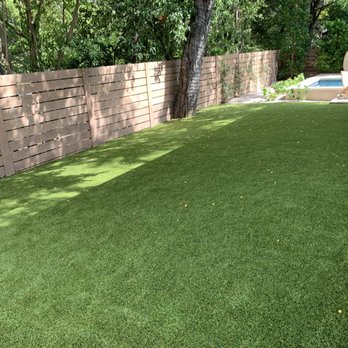 TexasTurf - a backyard with artificial grass and a pool - Landscaping Near Me - Lakeway, Texas