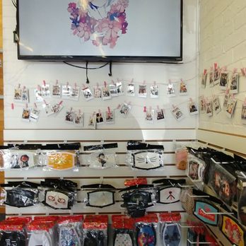 Teastori - Wall of masks for sale, where tables used to be @ Boba Cup Tampa. - Bubble Tea Near Me - Tampa, Florida