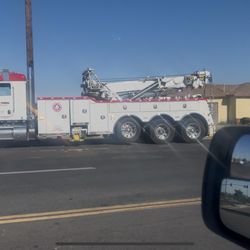 Action Towing - White male 50-60 years old. Walks RIGHT OUT IN FRONT OF 2vehicles ahead of me we slammed on brakes! Then cusses at us and flips us off!