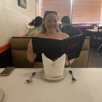 Siam Thai Cuisine - That's me reading the menu and enjoying the ambiance! - Thai Near Me - Mobile, Alabama