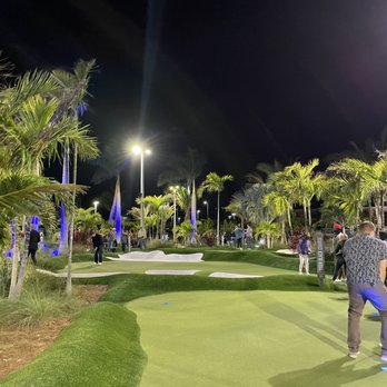 PopStroke - people playing golf at night - Mini Golf Near Me - Sarasota, Florida