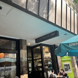 people sitting at tables outside