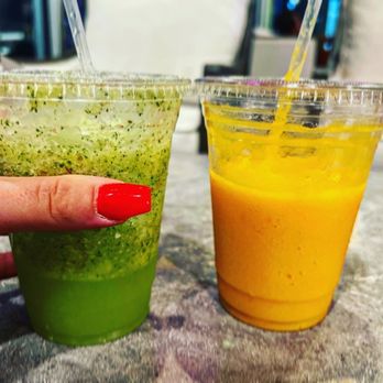 Zaman Cuisine - a woman's hand holding a plastic cup of juice - Halal Near Me - Orlando, Florida Zaman Cuisine - a woman's hand holding a plastic cup of juice - Halal Near Me - Orlando, Florida