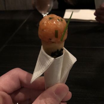 Next - The French Laundry | Atlantic salmon tartare in a black sesame cone filled with red onion crème fraiche - New American Near Me - Chicago, Illinois