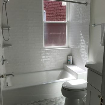 Click Construction and Remodeling - White bathroom w/ Marble tiles - General Contractors Near Me - Ashburn, Virginia