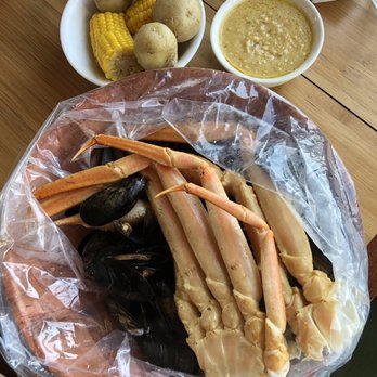 Ben's Crab - snow crab w/ mussels. potato and corn on side. garlic butter also on the side - Seafood Near Me - Oceanside, New York Ben's Crab - snow crab w/ mussels. potato and corn on side. garlic butter also on the side - Seafood Near Me - Oceanside, New York