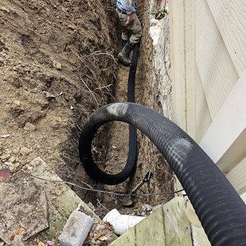 Bond Seal - a black hose connected to a house - Waterproofing Near Me - Elmwood, Ontario Bond Seal - a black hose connected to a house - Waterproofing Near Me - Elmwood, Ontario