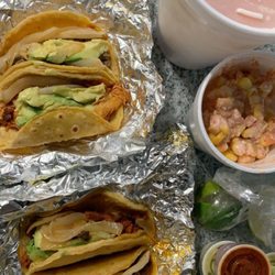 La Taquiza - Chicken, pork, steak & beef fajita. Cantaloupe aqua Fresca with elote on the side!