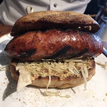 Meril - Pretzel bun with kielbasa sausage - New American Near Me - New Orleans, Louisiana Meril - Pretzel bun with kielbasa sausage - New American Near Me - New Orleans, Louisiana