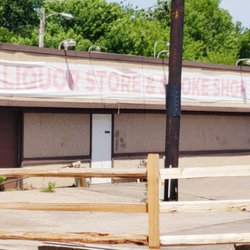 Crooks Smoke Shop - Immediately after the exit, turn right onto our entrance road along side the wooden privacy fence.  We are on your left.