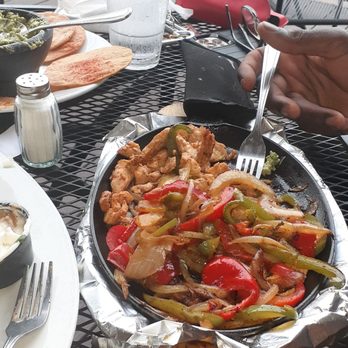 Las Flores - Chicken fajitas on cast iron skillet - Mexican Near Me - Conyers, Georgia